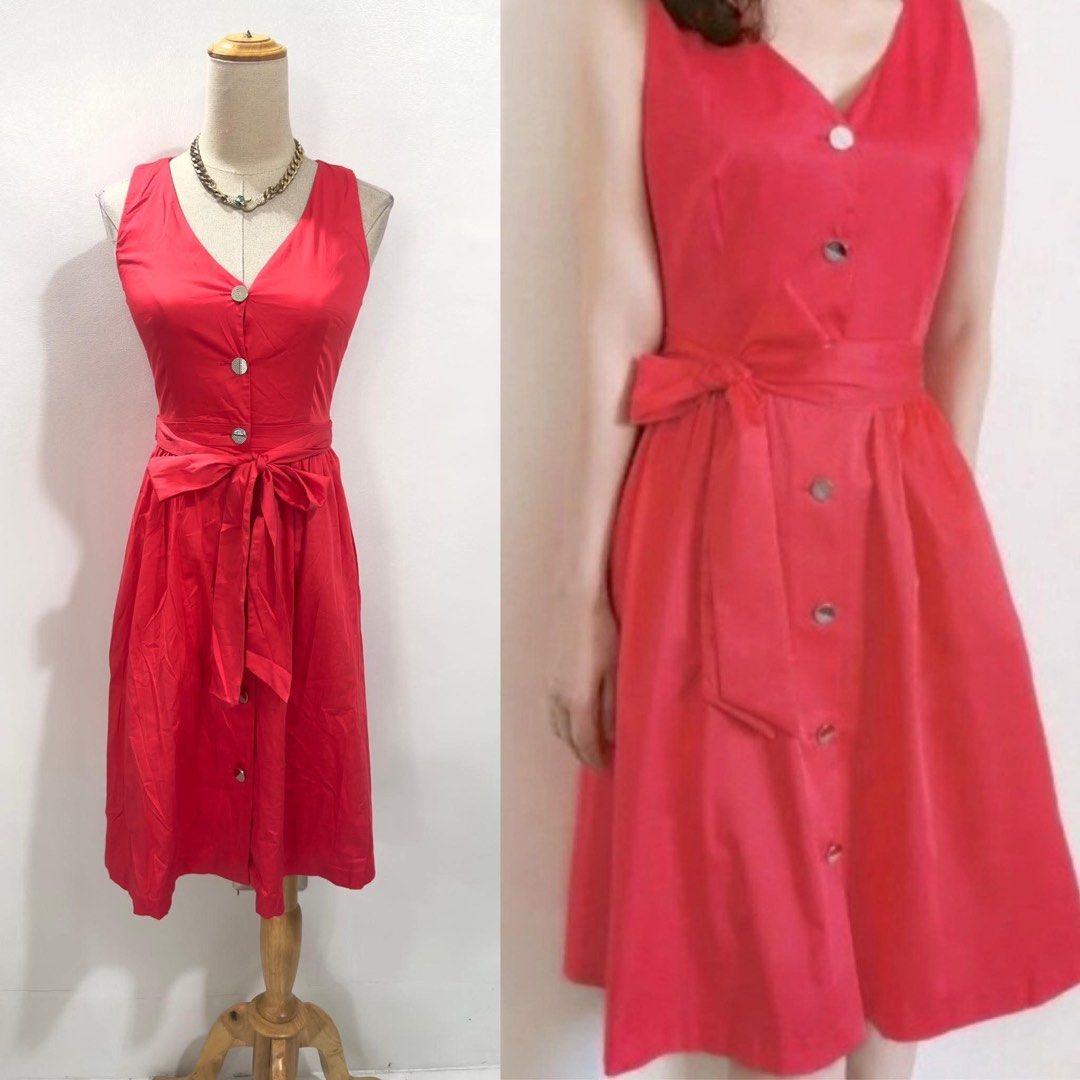 Ted Baker Red Sleeveless Button-Down Midi Dress (Category: Dresses) located in Bacolod City. Submitted by bhabissagal-05763 (Listing ID 1470653742, Image 2). Description: - Brand: Ted Baker - Color: Vibrant red - Style: Sleeveless midi dress with V-neckline and flared A-line skirt - Details: Functional front button placket and matching waist tie sash - Length: Knee-length - Fabric: Structured and high-quality - Special Feature: Inner collar label
