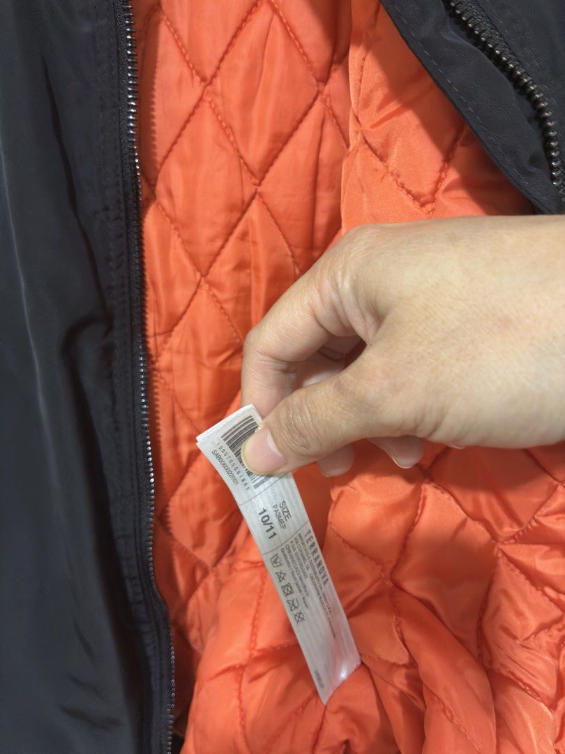 Terranova Black Bomber Jacket Age 10/11 140/146 (Category: Coats, Jackets and Outerwear) located in Mandaluyong City. Submitted by littlecatstore (Listing ID 1470632876, Image 3). Description: - Brand: Terranova - Item: Black bomber jacket with bright orange quilted lining - Size: Age 10/11 years (Height 140/146 cm) - Features: Zip-up front, zipped side pockets, sleeve utility pocket, and ribbed collar, cuffs, and hem.