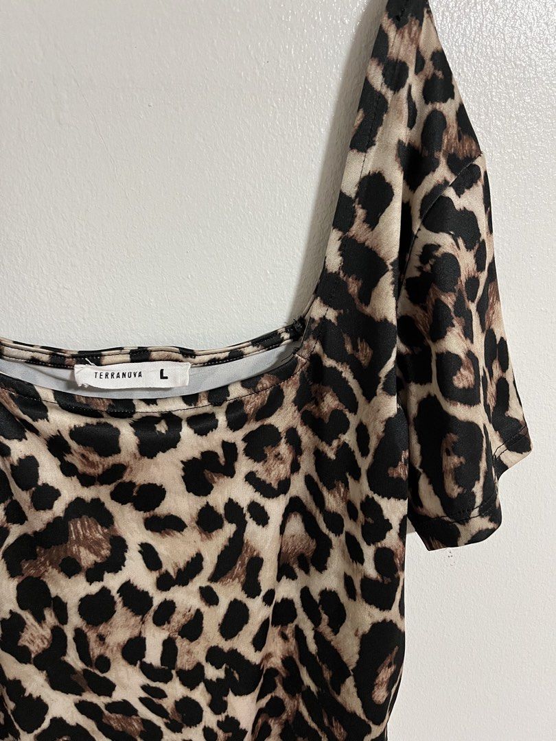 Terranova Leopard Print Bodysuit (Category: Bikinis & Swimsuits) located in Cabuyao City. Submitted by rdtrmt (Listing ID 1470573612, Image 2). Description: - Brand: Terranova - Size: Large - Print: Bold leopard print - Design: Square neckline, thin black spaghetti straps, and short draped cold-shoulder sleeves - Closure: Convenient snap closure at the bottom - Fit: Stretchy, comfortable, and easy to wear - Condition: still in good condition .