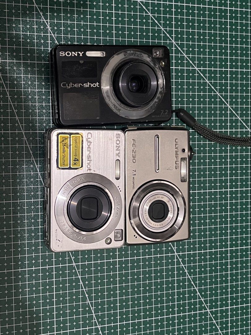 TESTED & UNTESTED DIGICAM [SONY & OLYMPUS] (Category: Cameras) located in Pasig City. Submitted by xoxoyours (Listing ID 1470629760, Image 1). Description: Can be sold as bundle [950 if bundle] OLYMPUS [UNTESTED] -i have no battery to test body cosmetics 9/10 ang kinis pa Both Sony Dscw110 are working can be use for parts or pagpalitin nyo parts nilang dalawa issue: the black one is lens stuck and some screws are missing na:( silver naman is blac