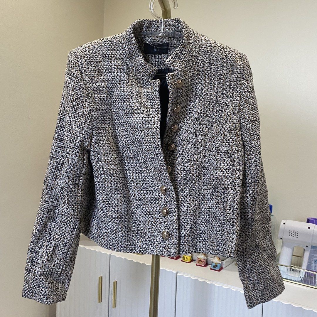 Textured tweed jacket with embossed gold buttons (Category: Coats, Jackets and Outerwear) located in Marikina City. Submitted by lovegoeson (Listing ID 1470724693, Image 1). Description: - Style: Chic tweed jacket in a black, white, and tan weave - Design: Stand collar, structured shoulders, and cropped cut - Details: Ornate gold metallic buttons on the front placket and cuffs - Comfort: Fully lined interior for a smooth fit.