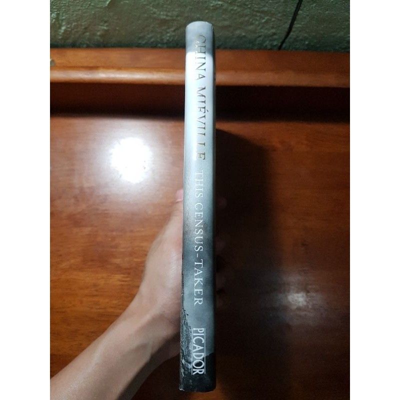 The Census-Taker by China Miéville (Category: Storybooks) located in La Carlota. Submitted by brightdragon_891870 (Listing ID 1470667308, Image 3). Description: In a remote house on a hilltop, a lonely boy witnesses a traumatic event. He tries - and fails - to flee. Left alone with his increasingly deranged parent, he dreams of safety, of joining the other children in the town below, of escape. When at last a stranger knocks at his door, the boy 