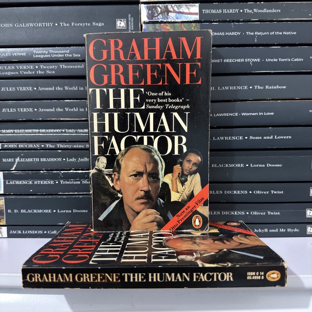 The Human Factor by Graham Greene paperback (Category: Storybooks) located in Lingayen. Submitted by readwjane (Listing ID 1470704612, Image 1). Description: - Title: The Human Factor by Graham Greene - Edition: Vintage paperback with rare Otto Preminger movie tie-in cover art - ISBN: 0 14 00.4956 8 - Genre: Classic spy thriller - Condition: Pages are completely intact with moderate shelf wear along the edges.