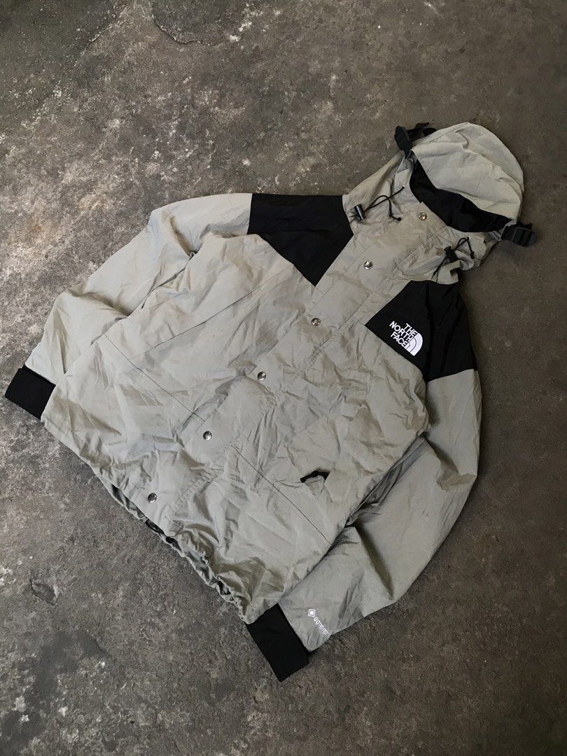 The North Face (Category: Coats, Jackets and Outerwear) located in Iriga City. Submitted by thrift_dshph (Listing ID 1470648398, Image 1). Description: The North Face Goretex 2 tone (Black & Green) Size: M on tag (23x27) Like new condition Complete tags Authentic Non issue.