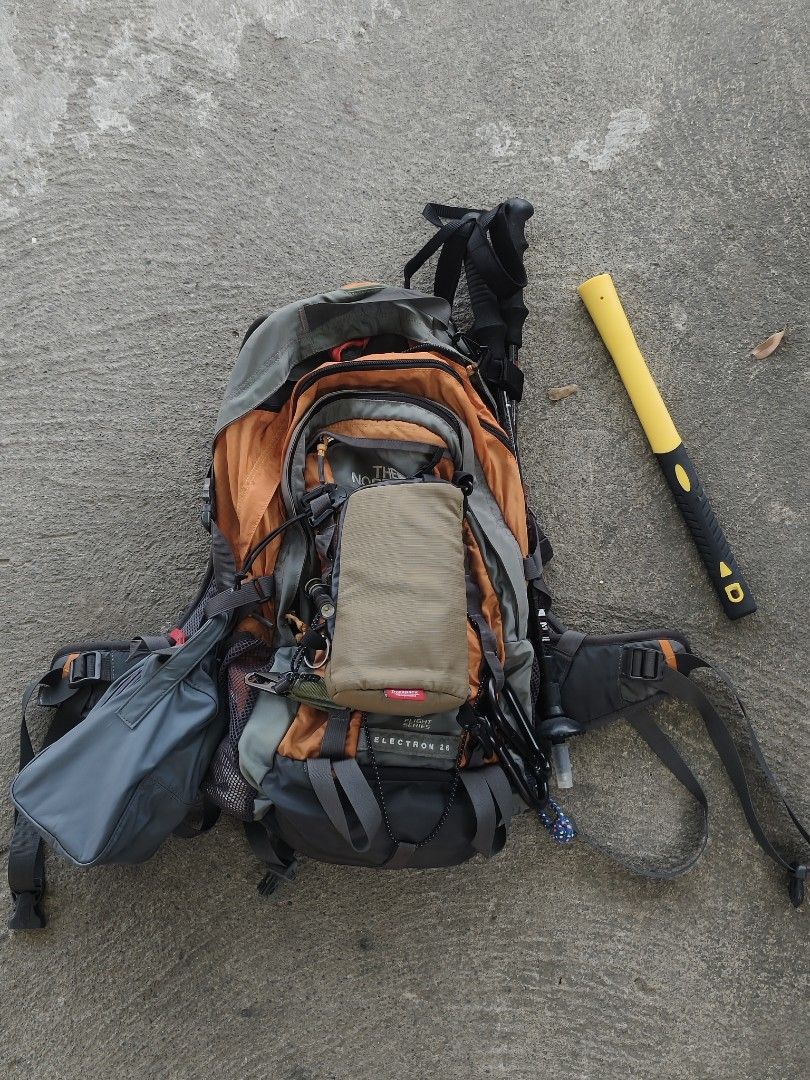 The North Face Electron 26 Hiking Backpack Gear Bundle (Category: Backpacks) located in Manila. Submitted by joshespino71762 (Listing ID 1470609949, Image 2). Description: - Brand: The North Face - Model: Electron 26 Backpack (Grey and Orange) - Includes high-visibility yellow rain cover - Complete trekking gear set: trekking poles with carry bag, crampons, and protective gloves - Utility accessories: utility pouch, hammer, and arm sleeves includ