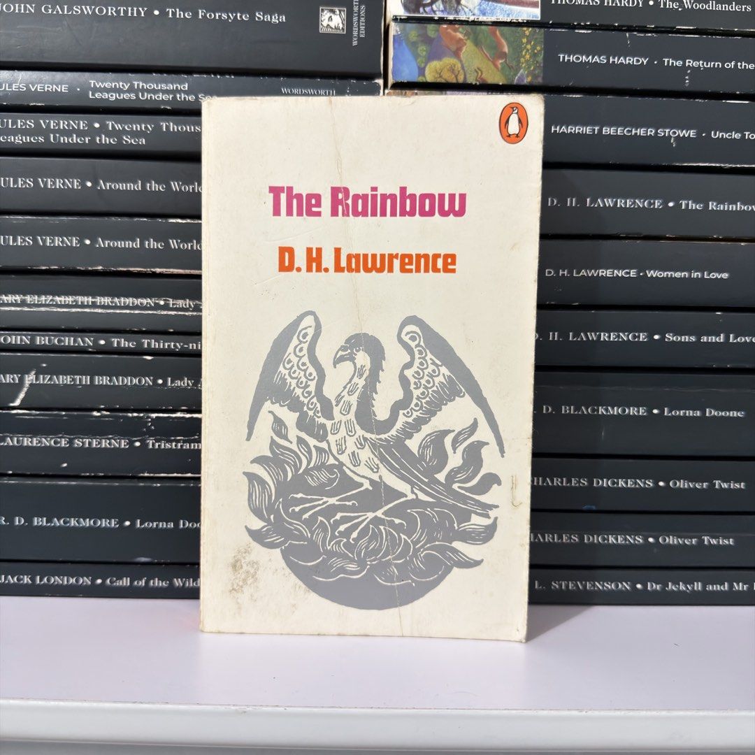 The Rainbow by D.H. Lawrence Penguin Paperback Edition (Category: Storybooks) located in Lingayen. Submitted by readwjane (Listing ID 1470704598, Image 1). Description: - Title: The Rainbow by D.H. Lawrence - Edition: Vintage Penguin paperback - Cover: Classic orange and pink typography on white with a phoenix illustration - Condition: Readable pages, great for collectors - Perfect addition to any classic literature bookshelf.