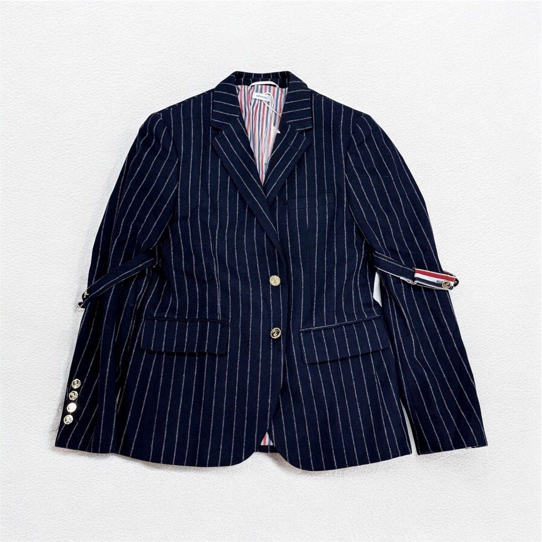 Thom Browne navy blue chalk-stripe blazer (Category: Activewear) located in Manila. Submitted by mankindarchivesv2 (Listing ID 1470692254, Image 2). Description: Thom Browne navy blue chalk-stripe blazer featuring signature sleeve armbands, gold-tone buttons, and striped lining Size: 2 Excellent condition / No hidden issue Price: 6000 php Mode of payment G cash Bank Courier Jnt lalamove Pm me if interested .