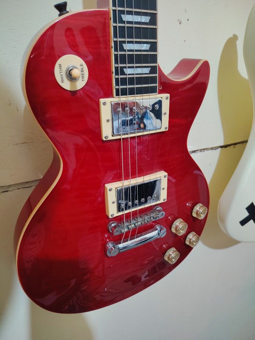 Thomson Les Paul Electric Guitar Cherry Red (Category: Musical Instruments) located in Dasmarinas. Submitted by joren4093 (Listing ID 1470659040, Image 3). Description: -naka epiphone pickups na dual humbucker na -low action -may split coil na rin Issue: Minimal paint chips lang sa likod Negotiable pa.