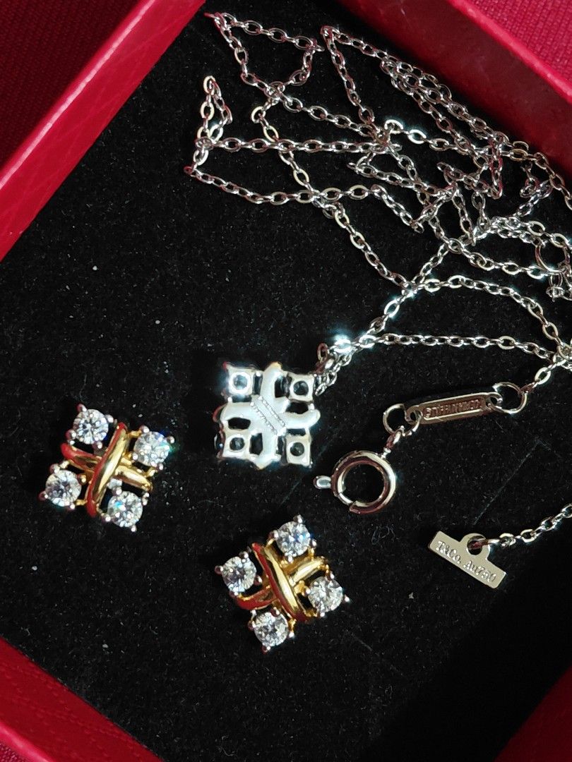 Tiffany&Co Set (Category: Earrings) located in Guiguinto. Submitted by blader2980 (Listing ID 1470685914, Image 2). Description: - T&Co. Au750 - Complete jewelry set including necklace and matching stud earrings - Elegant HK jewelry design featuring a gold and silver tone cross-accent with sparkling stones - Perfect accessory for casual days, parties, and special events - Authenticity not guaranteed and items are untested - Beautiful addition to 