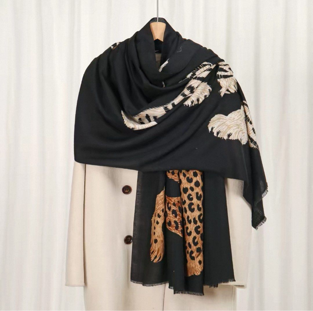 Tiger and Leopard Print Long Scarf Shawl (Category: Scarves) located in Calapan. Submitted by kawushii (Listing ID 1470695542, Image 3). Description: - Statement tiger and leopard print design - Soft, beautiful draping fabric with fringe edges - Versatile styling: wear as a cozy shawl or wrap around coats - Ideal for cooler weather - Available in 2 colors: black and white 📍Taguig manila.