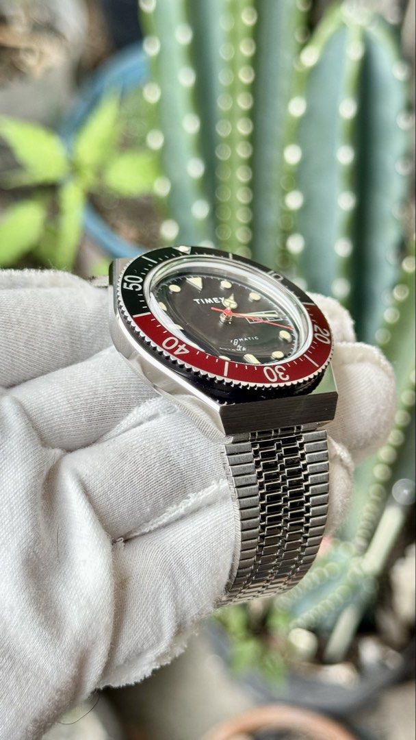 Timex Automatic Vintage Style Diver Watch Red Black (Category: Men's Watches) located in Manila. Submitted by junjun12356 (Listing ID 1470558555, Image 3). Description: - Brand: Timex - Movement: Automatic - Dial: Black with day-date window at 3 o'clock - Bezel: Red and black - Case: Stainless steel with polished finish and clean crystal - Strap: Matching metal mesh bracelet - Condition: Keeps time well, classic vintage look, perfect daily driver