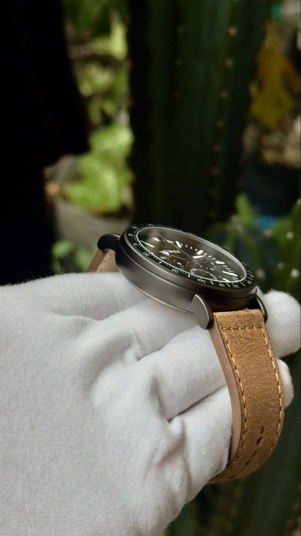 Timex Chronograph Watch with Leather Strap (Category: Men's Watches) located in Manila. Submitted by junjun12356 (Listing ID 1470557898, Image 3). Description: Timex chronograph watch featuring a dark grey dial and tachymeter bezel. Brown leather strap with contrast stitching and buckle closure. Sub-dials track minutes and seconds, plus a date window at the four o'clock position. White hands and hour markers stand out clearly against the face. Ma