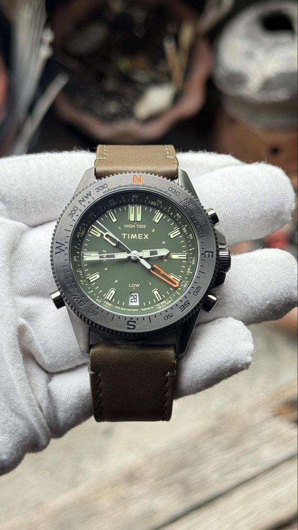 Timex Tide Temperature Compass Watch (Category: Men's Watches) located in Manila. Submitted by junjun12356 (Listing ID 1470703181, Image 1). Description: - Brand/Model: Timex Tide Temp Compass watch - Condition: Worn only a few times, extremely clean crystal and leather strap - Dial & Case: Olive green dial housed in a dark gunmetal case - Strap: Brown leather strap with matching buckle - Features: Sub-dials for tide, temperature, and compass rea