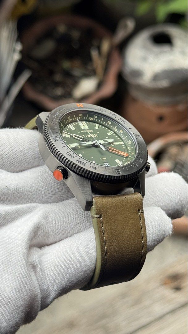 Timex Tide Temperature Compass Watch (Category: Men's Watches) located in Manila. Submitted by junjun12356 (Listing ID 1470703181, Image 2). Description: - Brand/Model: Timex Tide Temp Compass watch - Condition: Worn only a few times, extremely clean crystal and leather strap - Dial & Case: Olive green dial housed in a dark gunmetal case - Strap: Brown leather strap with matching buckle - Features: Sub-dials for tide, temperature, and compass rea