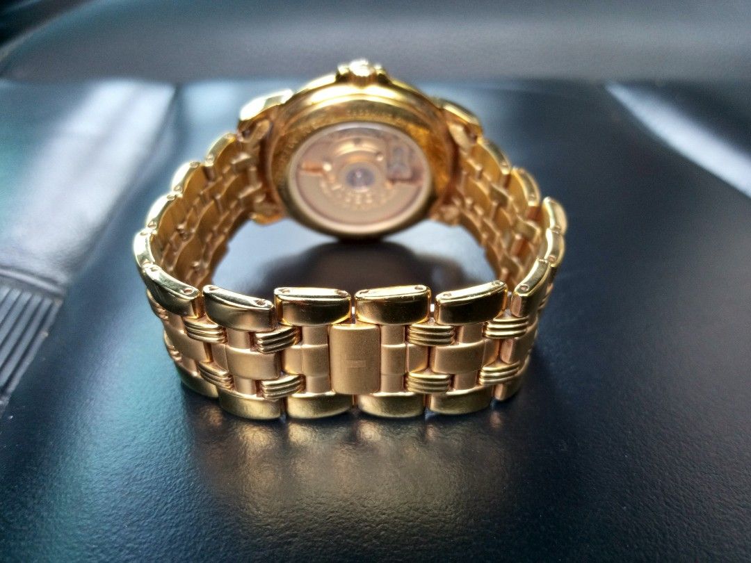 Tissot Ballade Automatic Gold Tone Watch (Category: Luxury Watches) located in Malolos. Submitted by lizarondoe59660 (Listing ID 1470679306, Image 2). Description: - Brand: Tissot Ballade Automatic - Finish: Elegant gold-tone stainless steel (case and matching link bracelet) - Dial: Champagne with classic Roman numerals and 3 o'clock date window - Crystal & Caseback: Sapphire crystal with exhibition display back showing the 25-jewel movement - Cl
