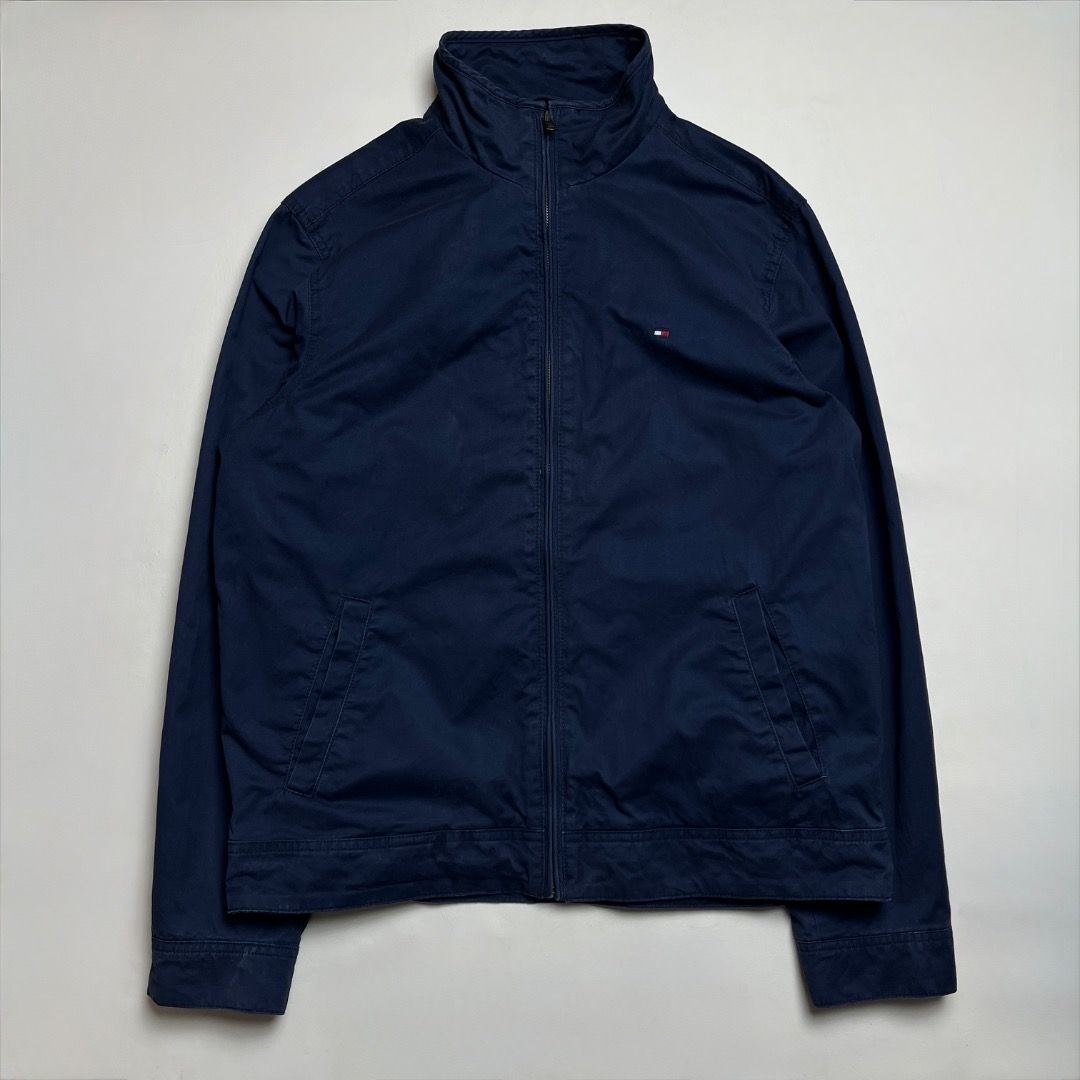 Tommy Hilfiger Harrington Jacket (Category: Coats, Jackets and Outerwear) located in Caloocan City. Submitted by achilles_grails (Listing ID 1470563577, Image 1). Description: - Brand: Tommy Hilfiger - Style: Harrington Jacket - Color: Classic Navy Blue - Lining: Blue and white checkered interior pattern - Details: Stand collar, full front zipper, signature embroidered flag logo on the chest - Condition: Excellent pre-owned condition with origina