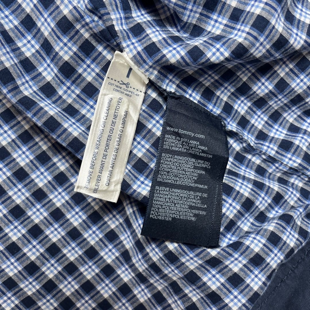 Tommy Hilfiger Harrington Jacket (Category: Coats, Jackets and Outerwear) located in Caloocan City. Submitted by achilles_grails (Listing ID 1470563577, Image 3). Description: - Brand: Tommy Hilfiger - Style: Harrington Jacket - Color: Classic Navy Blue - Lining: Blue and white checkered interior pattern - Details: Stand collar, full front zipper, signature embroidered flag logo on the chest - Condition: Excellent pre-owned condition with origina
