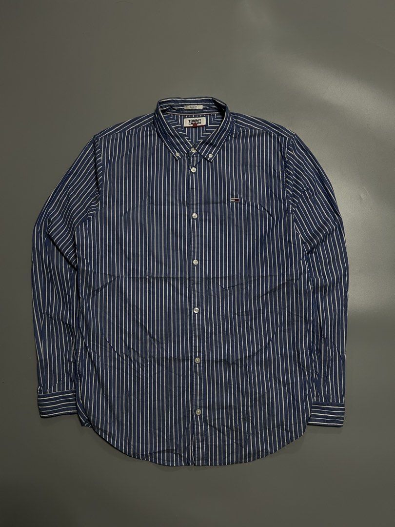 Tommy hilfiger pinstripe classic button down polo (authentic) (Category: Formal Shirts) located in Trece Martires City. Submitted by flip_flips (Listing ID 1470699206, Image 1). Description: Tommy hilfiger pinstripe classic button down polo (authentic) -Dimes: 22 width 30 length -Excellent condition -9.5/10 color rate -issue: none.