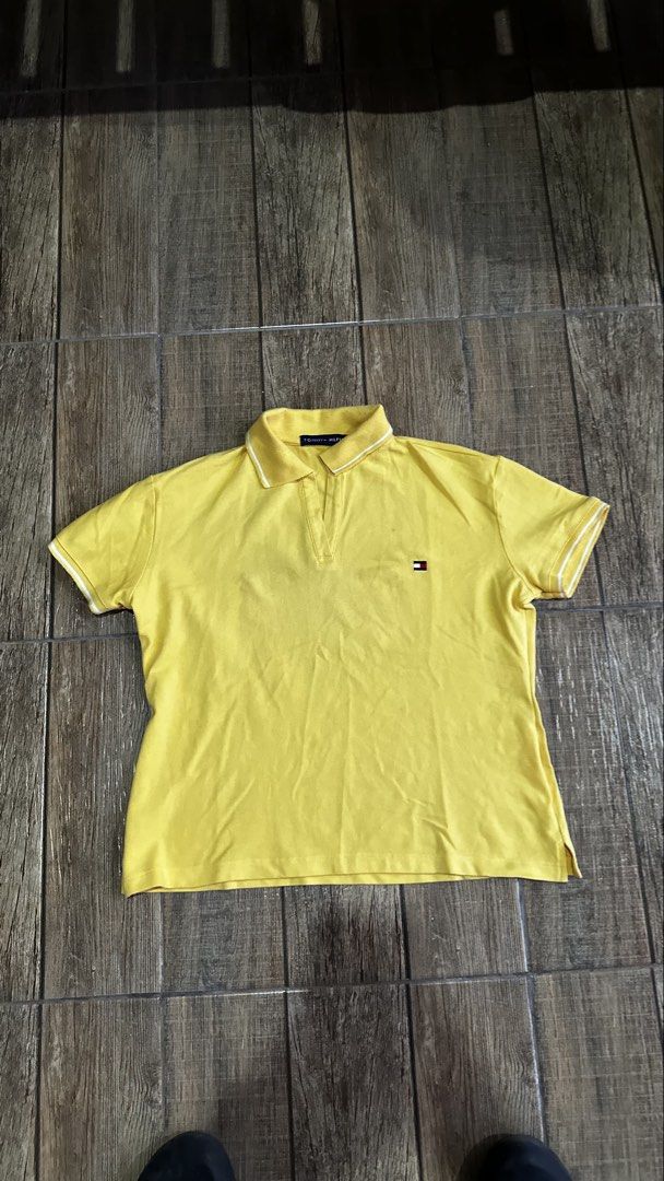 TOMMY YELLOW POLO (Category: Shirts) located in Manila. Submitted by urban.vintage (Listing ID 1470612870, Image 1). Description: ISSUE: NONE (NEED WASH) MOP :GCASH (NO COD) SHIP VIA: LALAMOVE & J&T LOCATION: PASIG CITY LENGTH: 23 WIDTH : 22.