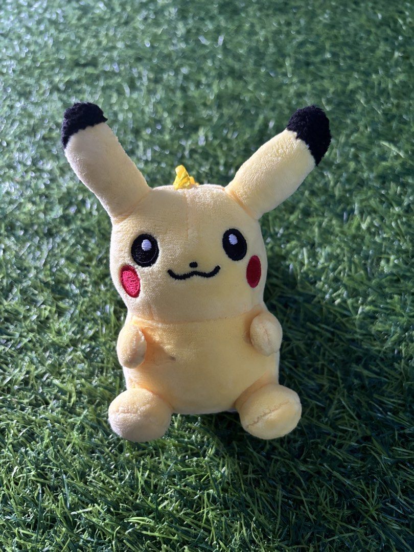 TOMY Pokémon Pikachu Plush Toy (Category: Plushies & Soft Toys) located in Makati City. Submitted by rare_thrift_stuff (Listing ID 1470612480, Image 1). Description: - Official TOMY Pokémon Pikachu plush - Bright yellow body with embroidered facial features and classic red cheeks - Features brown stripes on the back and black-tipped ears - Attached TOMY tag intact with registration details and CE mark - Clean fabric overall, great for collectors 