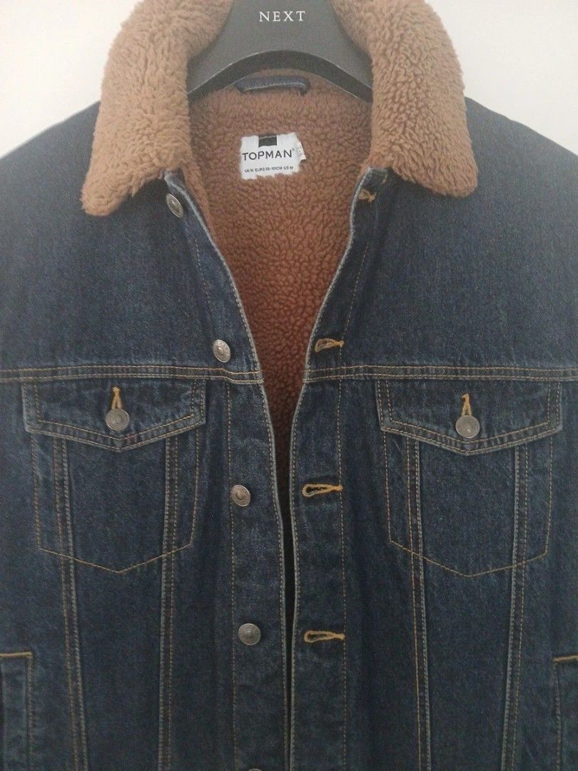 Topman Sherpa Denim Jacket (Category: Coats, Jackets and Outerwear) located in Quezon City. Submitted by epoquebyjaz (Listing ID 1470637764, Image 1). Description: - Brand: Topman - Size: XXS - Material: Classic denim exterior with thick brown sherpa fleece lining and collar - Features: Button-up front, dual chest pockets, and side pockets - Condition: Great for cold weather and layering.