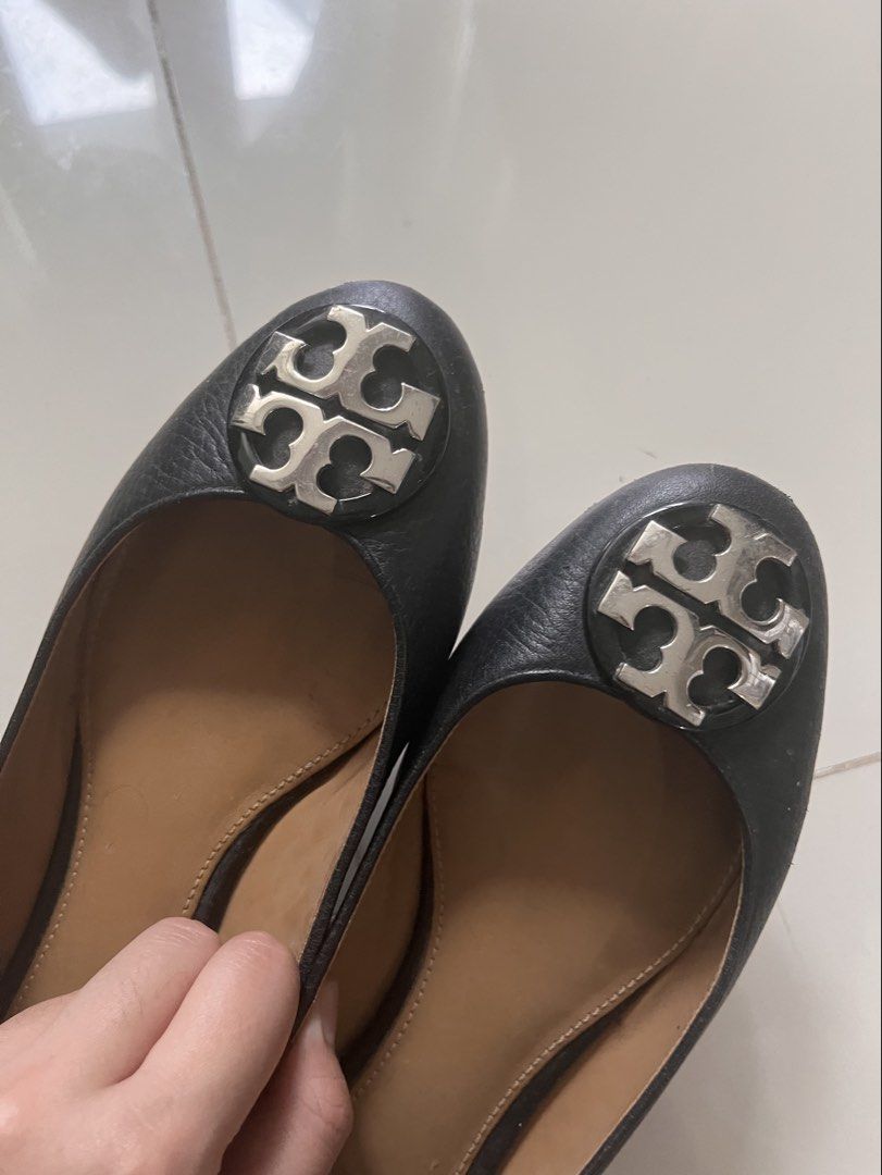 Tory Burch Black Leather Flats Size 6 (Category: Flats & Sandals) located in Quezon City. Submitted by blesshie_ (Listing ID 1470587309, Image 3). Description: - Brand: Tory Burch - Color: Classic black leather with tan insoles - Details: Signature silver hardware logo on rounded toes, slip-on style - Condition: Pre-loved with visible wear on the bottom tread and scuffs on the front edges; sole needs to be sewed again - Perfect for everyday casua