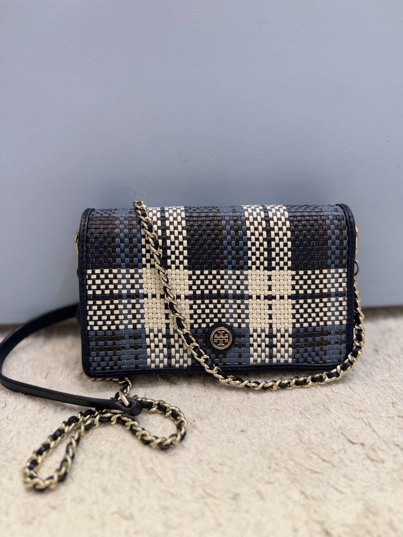 Tory Burch Crossbody bag (Category: Cross-body Bags) located in Rizal. Submitted by myleb.finds (Listing ID 1470592395, Image 2). Description: ✨ **A LITTLE DETAIL. A BIG STYLE STATEMENT.** 💙 Some bags complete an outfit. Others make the outfit. This beauty does both! 😍👜 Meet this eye-catching **T💙ry Burch woven crossbody bag**, featuring a beautiful navy, black, and cream pattern, signature logo detail, and a stylish half-leather, half-gold-c
