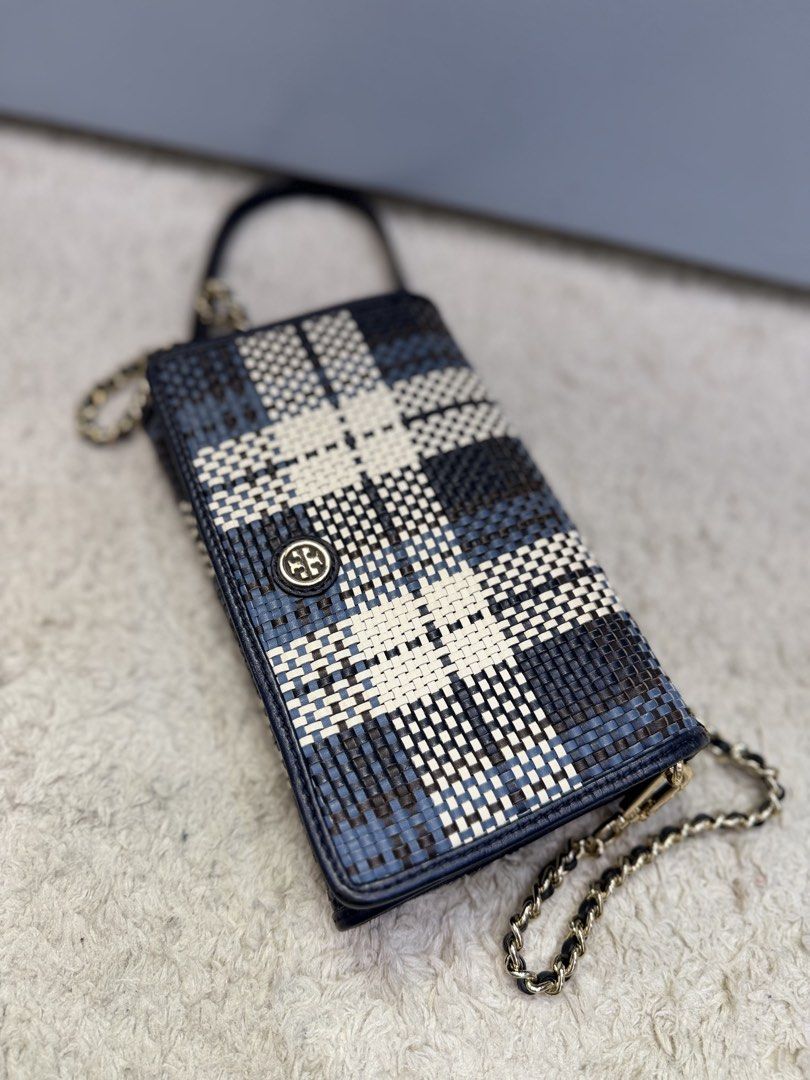 Tory Burch Crossbody bag (Category: Cross-body Bags) located in Rizal. Submitted by myleb.finds (Listing ID 1470592395, Image 3). Description: ✨ **A LITTLE DETAIL. A BIG STYLE STATEMENT.** 💙 Some bags complete an outfit. Others make the outfit. This beauty does both! 😍👜 Meet this eye-catching **T💙ry Burch woven crossbody bag**, featuring a beautiful navy, black, and cream pattern, signature logo detail, and a stylish half-leather, half-gold-c