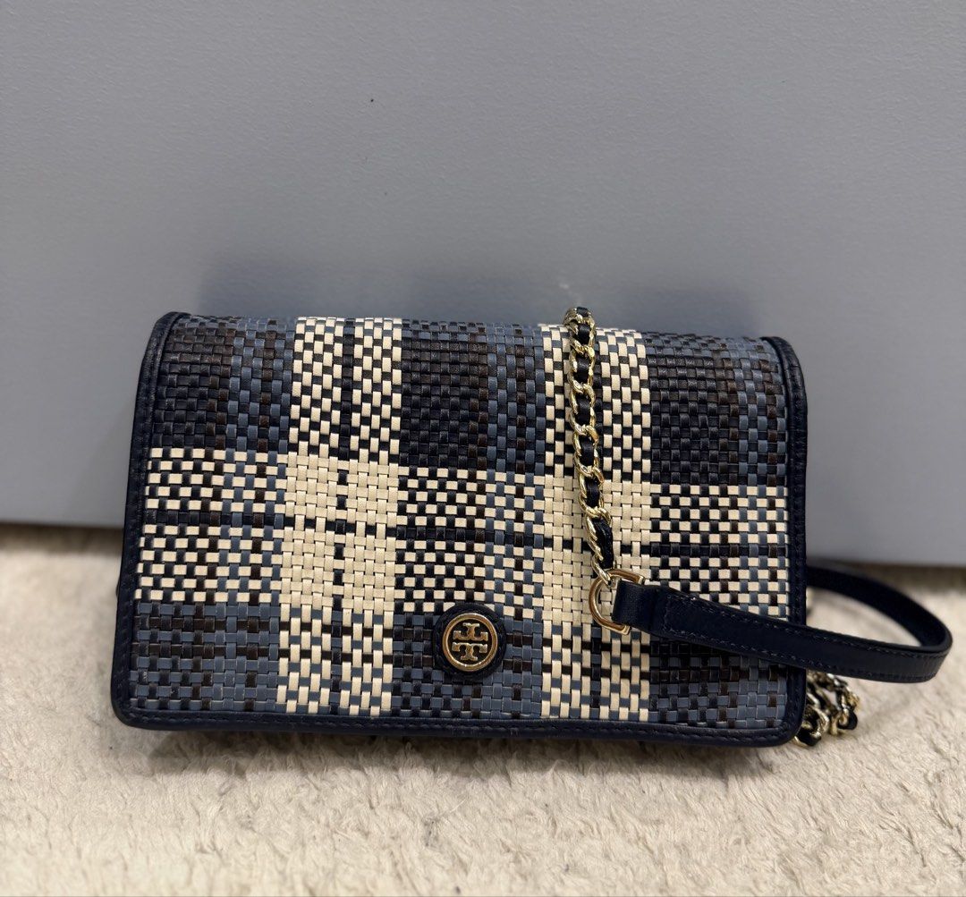 Tory Burch Crossbody bag (Category: Cross-body Bags) located in Rizal. Submitted by myleb.finds (Listing ID 1470592395, Image 1). Description: ✨ **A LITTLE DETAIL. A BIG STYLE STATEMENT.** 💙 Some bags complete an outfit. Others make the outfit. This beauty does both! 😍👜 Meet this eye-catching **T💙ry Burch woven crossbody bag**, featuring a beautiful navy, black, and cream pattern, signature logo detail, and a stylish half-leather, half-gold-c