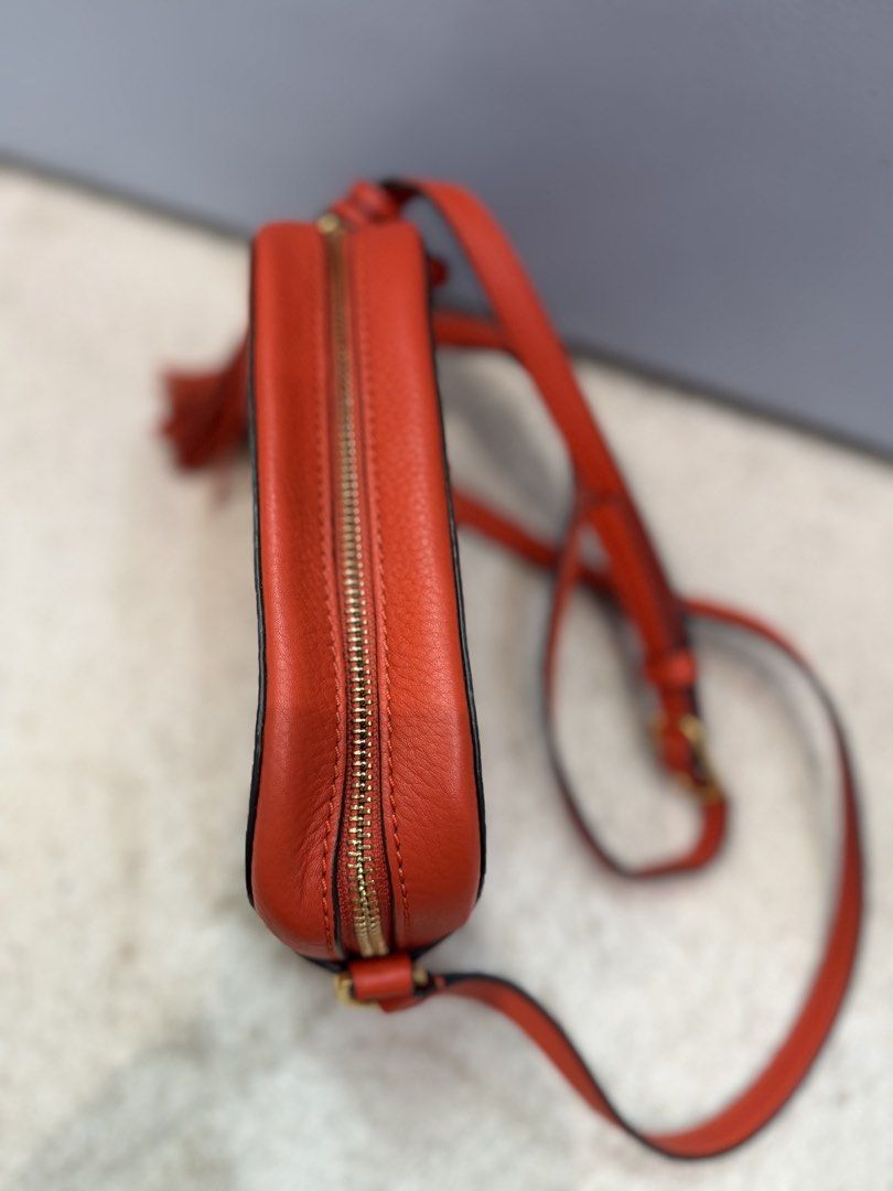 Tory Burch Crossbody bag (Category: Cross-body Bags) located in Rizal. Submitted by myleb.finds (Listing ID 1470592905, Image 3). Description: 🧡 **BOLD COLOR. TIMELESS STYLE.** 👜 Looking for a bag that adds instant character to your outfit? This gorgeous red-orange T😍ry Burch crossbody is a standout piece! ❤️✨ Featuring its signature double-T logo, textured finish, and stylish tassel detail, this beauty is perfect for those who love a little c