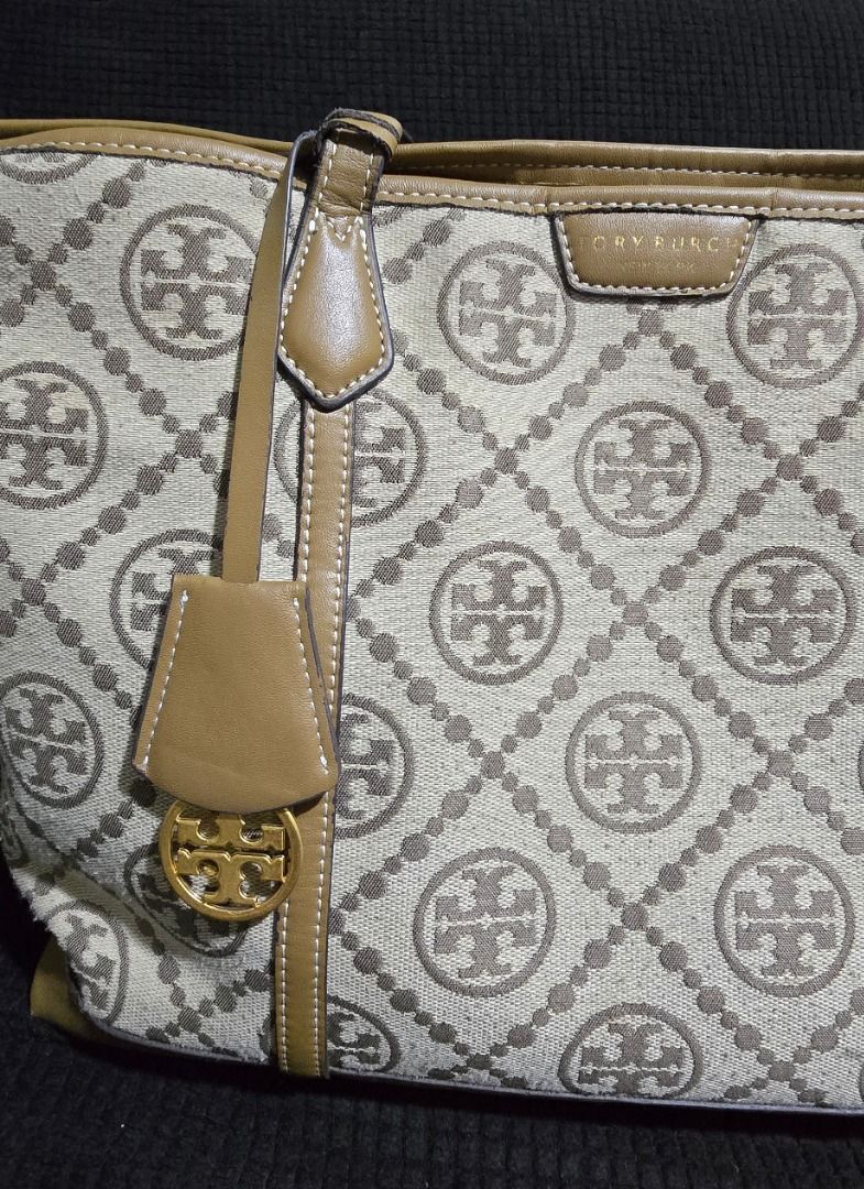 Tory Burch Monogram Tote Bag - Negotiable!!! (Category: Tote Bags) located in Manila. Submitted by axelyuna.27 (Listing ID 1470586201, Image 3). Description: Authentic Tory Burch tote in beige and brown canvas with tan leather trim. Features a structured base, gold-tone logo charm, and clean exterior. Interior shows normal signs of use and discoloration. Perfect everyday bag with classic monogram style!.