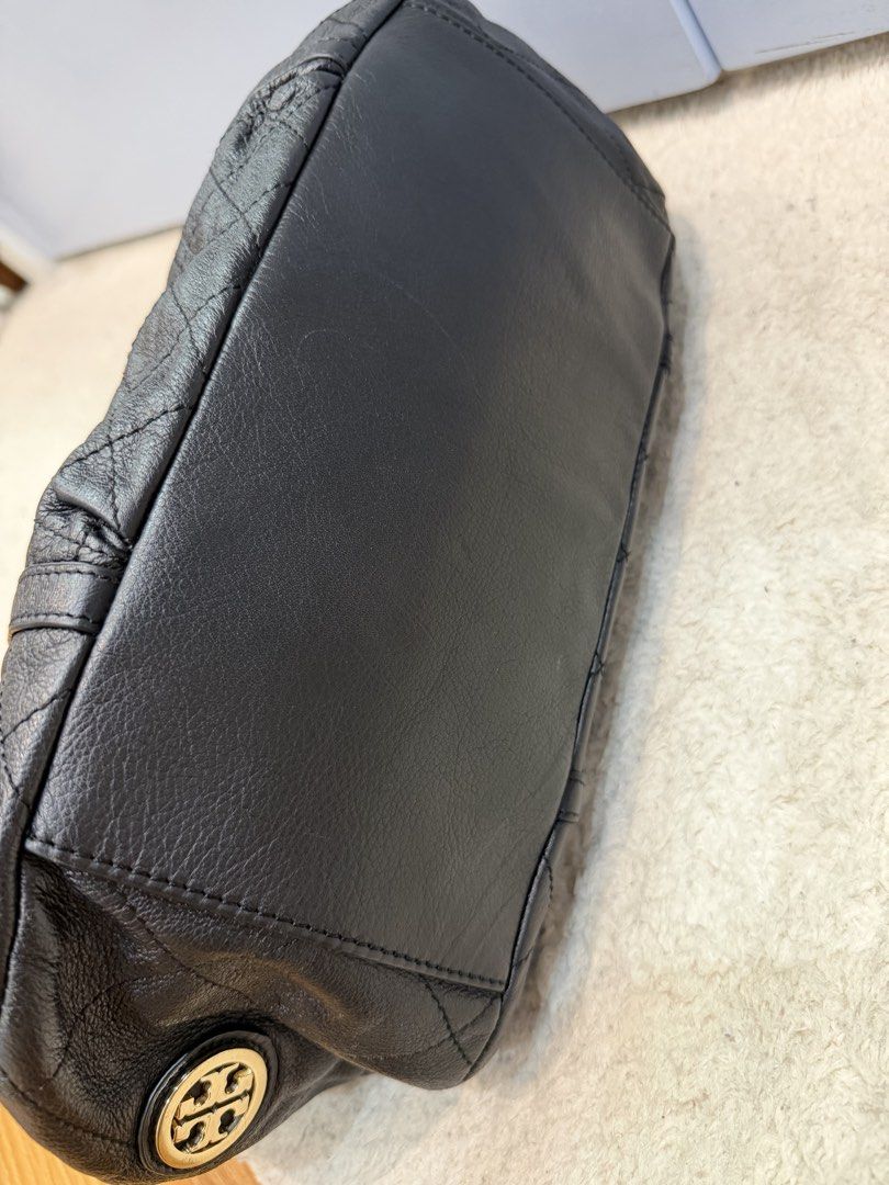 Tory Burch Shoulder Bag (Category: Shoulder Bags) located in Rizal. Submitted by myleb.finds (Listing ID 1470594039, Image 3). Description: 🖤 **A LITTLE EDGE. A LOT OF STYLE.** ✨ Not your ordinary black bag! 👜 This beauty brings together a relaxed slouchy silhouette, edgy gold chain details, and that effortlessly chic vibe we all love. 🖤✨ For the girl who loves style with a little attitude. 😉🤎 Would you rock this look? ♡ 📩 DM us for the pri