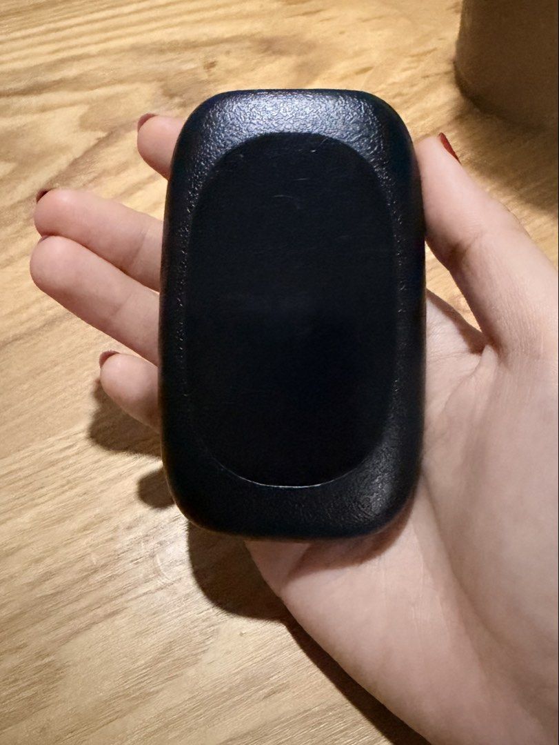 TP-Link Mobile Wi-Fi Hotspot (Category: Networking) located in Cebu City. Submitted by declutteringduo007 (Listing ID 1470617607, Image 2). Description: - Brand: TP-Link portable wireless router - Color/Finish: Sleek black with a textured grip - Design: Compact, palm-sized build with a convenient front power button - Indicators: Dual green status lights for battery and Wi-Fi signal - Use Case: Ideal for travel, commute, and reliable on-the-go int