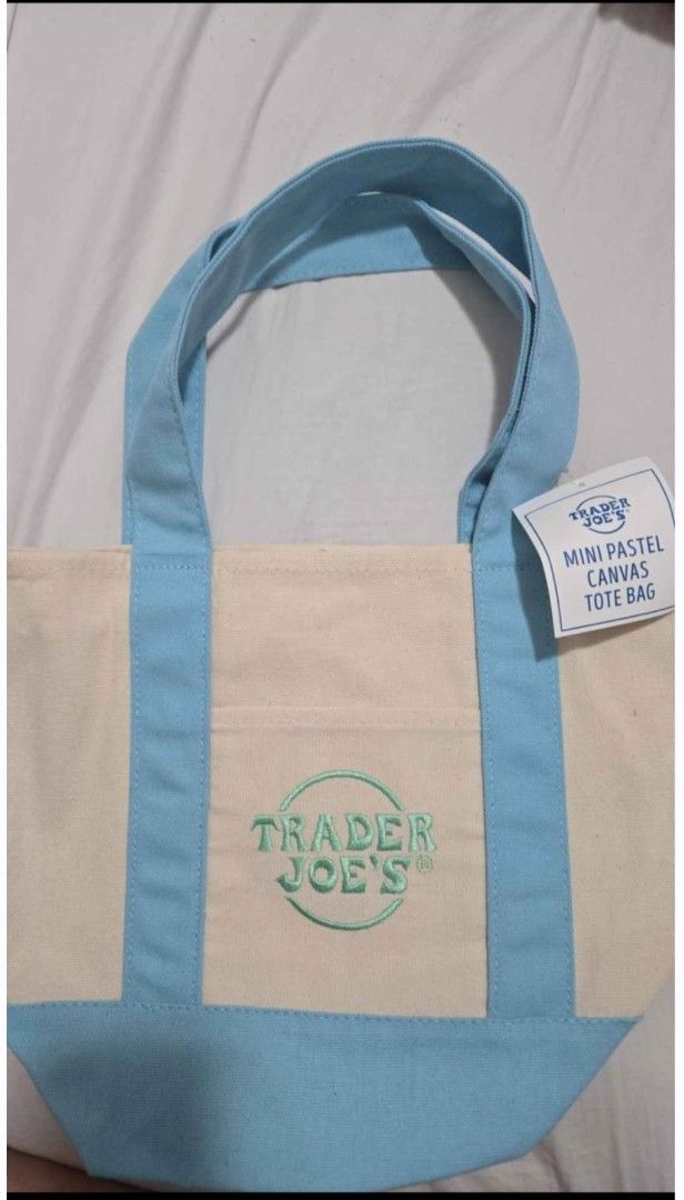 Trader Joe's Mini Canvas Tote Bag Pastel & Striped Colors (Category: Tote Bags) located in Quezon City. Submitted by ernestamaru2 (Listing ID 1470589607, Image 1). Description: - Authentic Trader Joe's mini canvas tote bags - Available in multiple pastel and striped colorways - Features sturdy handles, reinforced bottom, and exterior pocket - Signature embroidered logo on the front - Brand new with tags attached, completely unused - Perfect for g