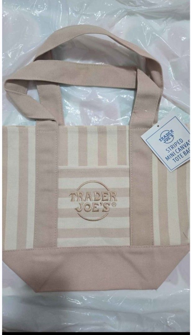 Trader Joe's Mini Canvas Tote Bag Pastel & Striped Colors (Category: Tote Bags) located in Quezon City. Submitted by ernestamaru2 (Listing ID 1470589607, Image 3). Description: - Authentic Trader Joe's mini canvas tote bags - Available in multiple pastel and striped colorways - Features sturdy handles, reinforced bottom, and exterior pocket - Signature embroidered logo on the front - Brand new with tags attached, completely unused - Perfect for g
