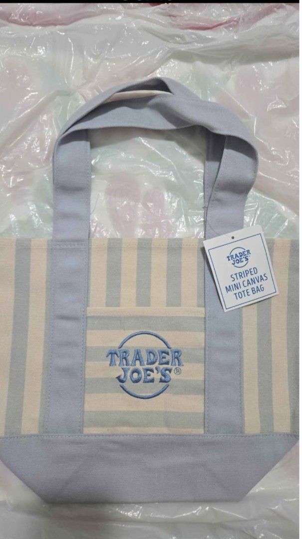 Trader Joe's Mini Canvas Tote Bag Pastel & Striped Colors (Category: Tote Bags) located in Quezon City. Submitted by ernestamaru2 (Listing ID 1470589607, Image 2). Description: - Authentic Trader Joe's mini canvas tote bags - Available in multiple pastel and striped colorways - Features sturdy handles, reinforced bottom, and exterior pocket - Signature embroidered logo on the front - Brand new with tags attached, completely unused - Perfect for g