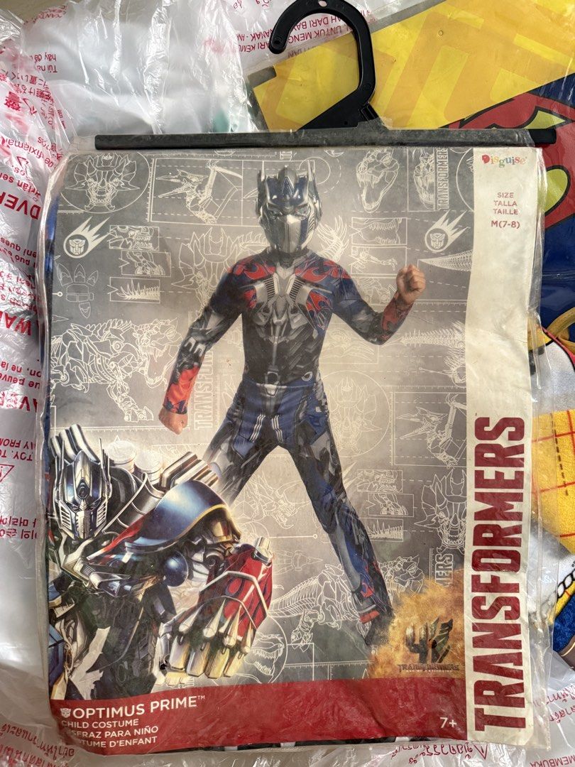 Transformers Optimus Prime Child Costume Size M 7-8 (Category: Babies & Kids Fashion) located in Muntinlupa City. Submitted by lemonbearph (Listing ID 1470574272, Image 1). Description: - Character: Transformers Optimus Prime - Size: M (7-8 years old) - Includes: Printed jumpsuit and mask - Condition: Brand new, sealed in original packaging on hanger - Ideal for: Dress-up, parties, and Halloween.