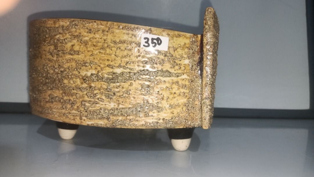Triangular Ikebana ceramic planter pot with three feet (Category: Pots & Planters) located in Munoz. Submitted by larryc1212 (Listing ID 1470633550, Image 2). Description: - Type: Triangular ceramic planter - Finish: Textured sandy exterior with glossy brown interior - Features: 3 sturdy feet for elevation - Size: Approx. 8 inchesacross the top, 5 incheshigh - Condition: Flawless, no chips or cracks - Ideal for: Succulents and small houseplants D
