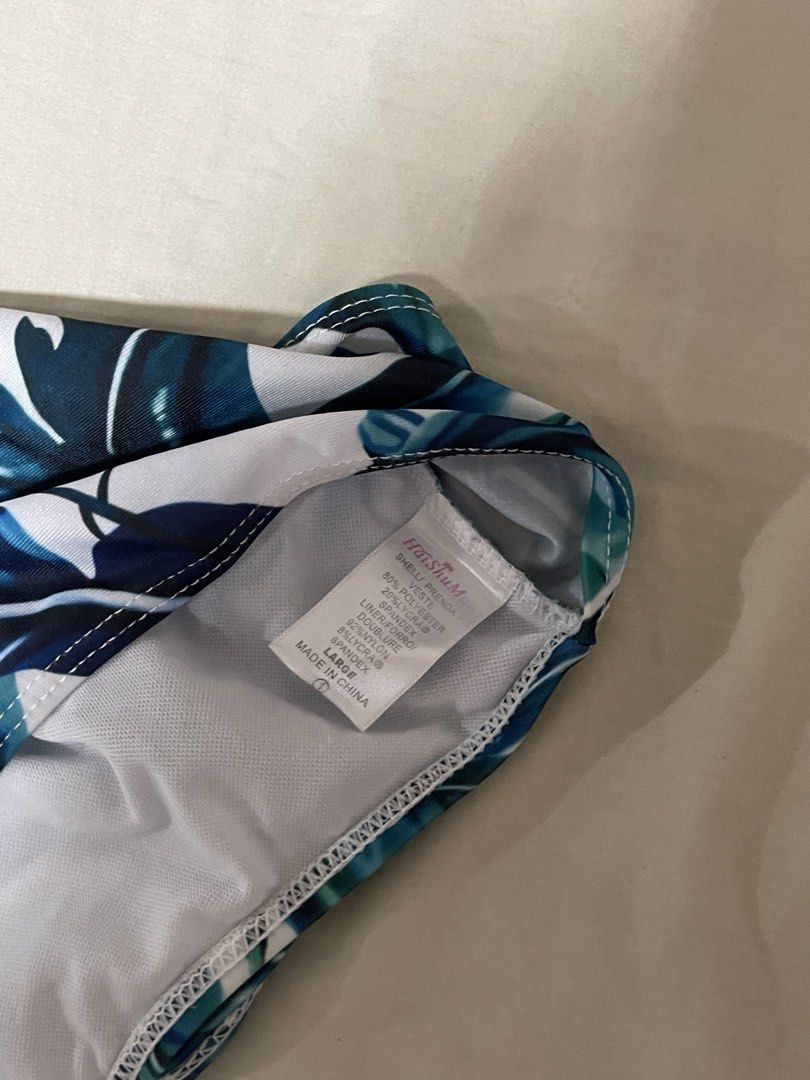 Tropical Leaf Print High Waist Bikini Bottom (Category: Bikinis & Swimsuits) located in Caloocan City. Submitted by sheshesheshesheshe13 (Listing ID 1470720175, Image 2). Description: - Style: High waist bikini bottom with chic strap detail across the top - Pattern: Blue and green tropical leaf print on a crisp white background - Material: Smooth and stretchy fabric for a comfortable fit.