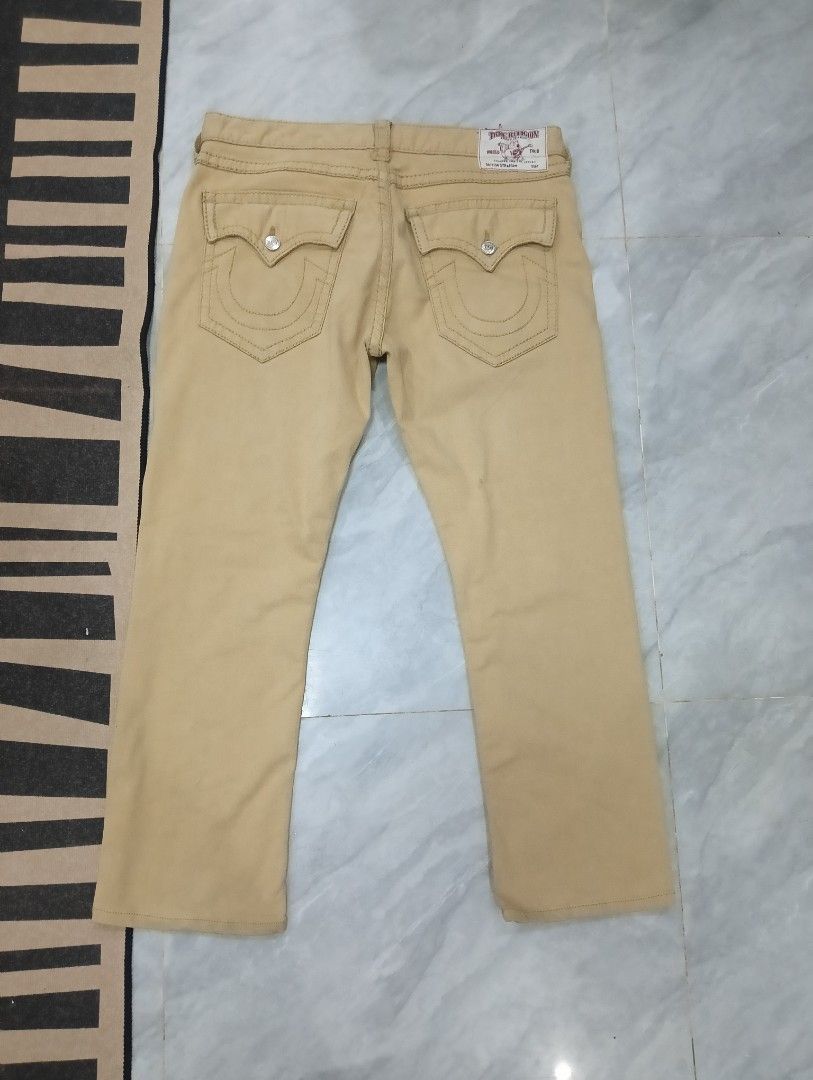 True Religion Straight Leg Jeans (Category: Jeans) located in Odiongan. Submitted by thrifthub_bundang07 (Listing ID 1470689517, Image 2). Description: - Brand: True Religion - Style: Straight leg fit - Color: Tan - Pockets: Classic button flap back pockets with iconic horseshoe stitching - Details: Branded leather patch on the back waistband and durable metal hardware throughout - Condition: Excellent pre-loved condition (ready to wear) - Mode o