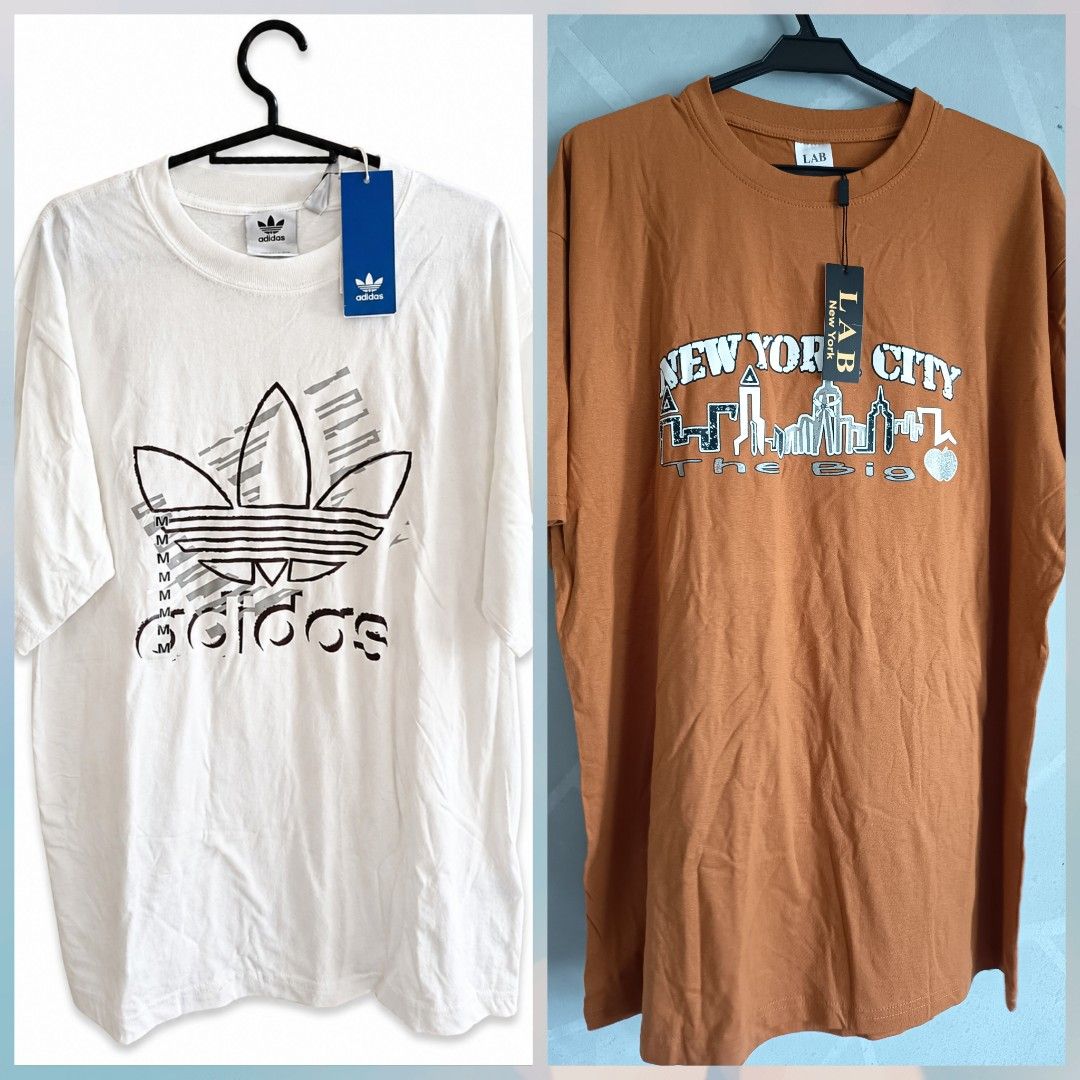 T-Shirt bundle sale (Category: Tshirts & Polo Shirts ) located in Las Pinas. Submitted by organizeaway (Listing ID 1470707462, Image 1). Description: - 2-piece brand new t-shirt bundle with original store tags still attached - Item 1: White Adidas Originals tee with large black trefoil logo 100% authentic size: medium - Item 2: Brownish-orange LAB New York City graphic tee with skyline artwork - Condition: 100% unworn, brand new with tags - Style