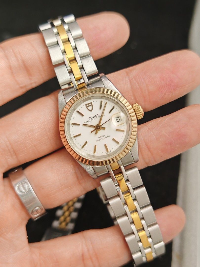 Tudor Princess Date 26mm (Category: Women's Watches) located in San Juan City. Submitted by MW_888 (Listing ID 1470689904, Image 2). Description: Tudor Princess Date 26mm Original Rolex caseback and Rolex crown White dial Two tone (Solid gold bezel) Ref 92413N B serial, 1993 both watch head and bracelet - period correct 8.5/10 condition Inclusions: watch, original Tudor bracelet fit to approx 7.8" wrist (with stretch consistent to age) and watch 