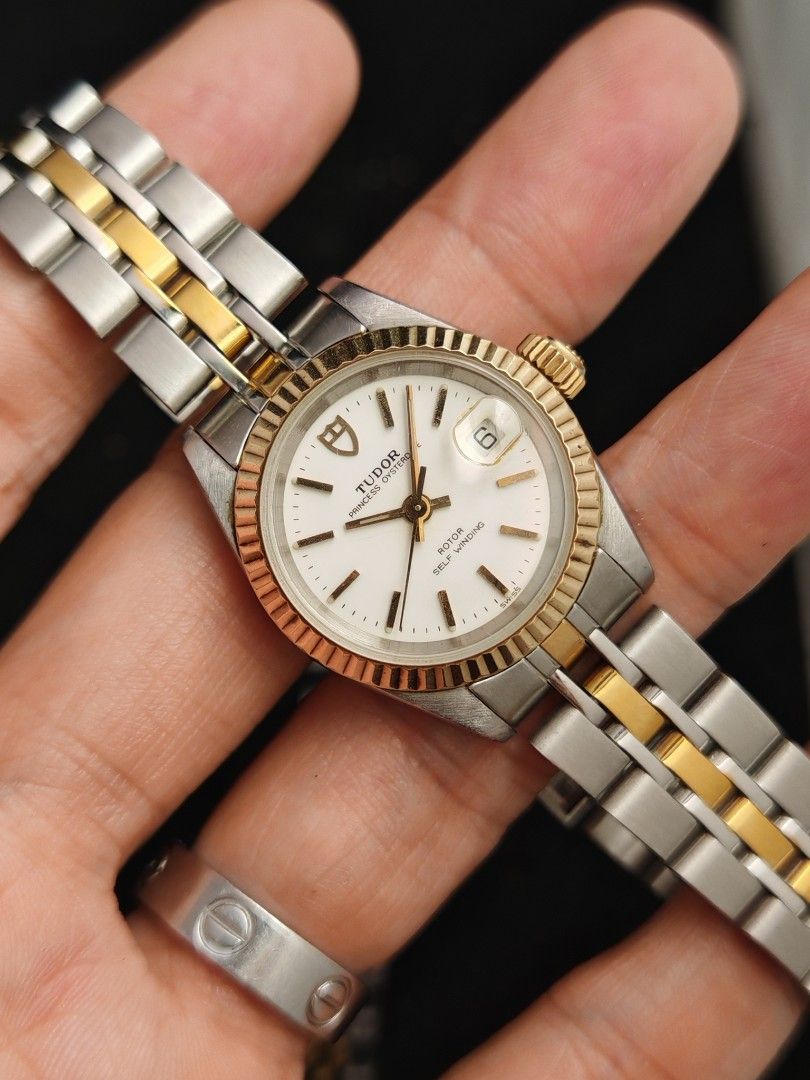 Tudor Princess Date 26mm (Category: Women's Watches) located in San Juan City. Submitted by MW_888 (Listing ID 1470689904, Image 3). Description: Tudor Princess Date 26mm Original Rolex caseback and Rolex crown White dial Two tone (Solid gold bezel) Ref 92413N B serial, 1993 both watch head and bracelet - period correct 8.5/10 condition Inclusions: watch, original Tudor bracelet fit to approx 7.8" wrist (with stretch consistent to age) and watch 