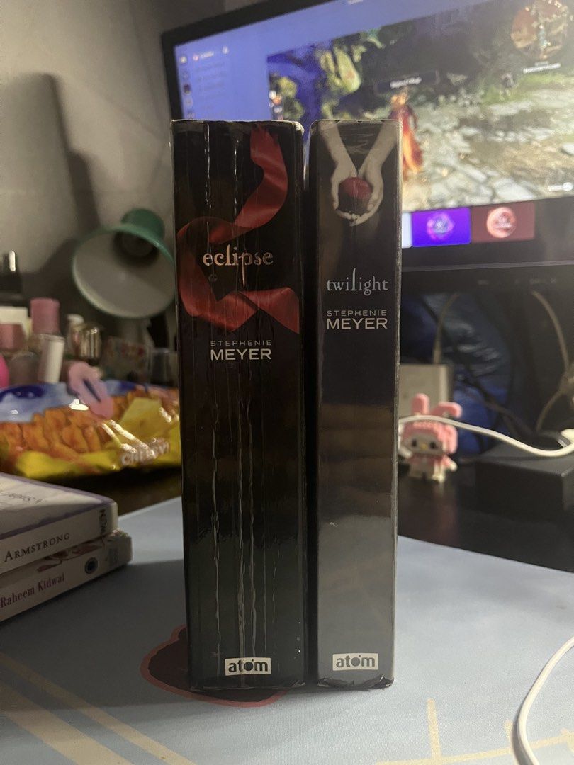 Twilight and Eclipse by Stephenie Meyer Paperback Novels (Category: Storybooks) located in Manila. Submitted by leizyfatima (Listing ID 1470722200, Image 2). Description: - Title: Twilight and Eclipse (Set of 2) - Author: Stephenie Meyer - Format: Paperback (Atom editions) - Condition: Pre-loved reading copies with edge wear, yellowing pages, and foxing due to age - Perfect for Twilight fans and collectors looking for affordable reads Rfs: need f