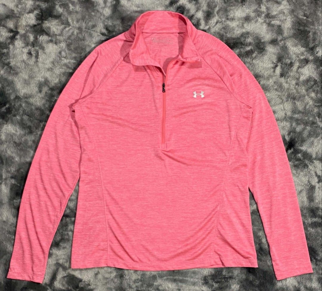 Under Armour HeatGear Pink Half-Zip Pullover (Category: Coats, Jackets and Outerwear) located in Sorsogon. Submitted by johnmichae69459 (Listing ID 1470679568, Image 1). Description: - Brand: Under Armour HeatGear - Color: Bright Pink with Silver Logo - Size: Large - 20 width - 27 lenght - Style: Half-zip pullover, loose fit, long sleeves - Material: Lightweight and breathable - Condition: Great for workouts or casual wear.