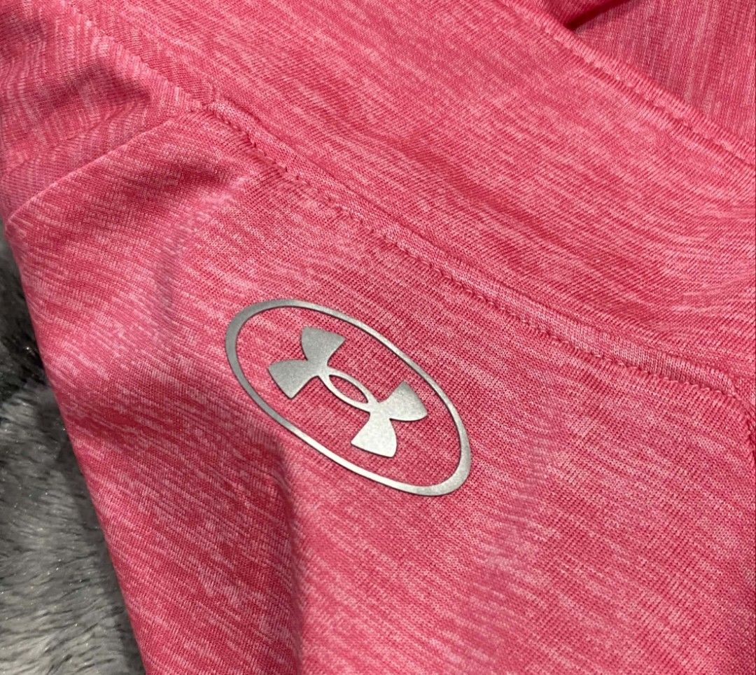 Under Armour HeatGear Pink Half-Zip Pullover (Category: Coats, Jackets and Outerwear) located in Sorsogon. Submitted by johnmichae69459 (Listing ID 1470679568, Image 2). Description: - Brand: Under Armour HeatGear - Color: Bright Pink with Silver Logo - Size: Large - 20 width - 27 lenght - Style: Half-zip pullover, loose fit, long sleeves - Material: Lightweight and breathable - Condition: Great for workouts or casual wear.