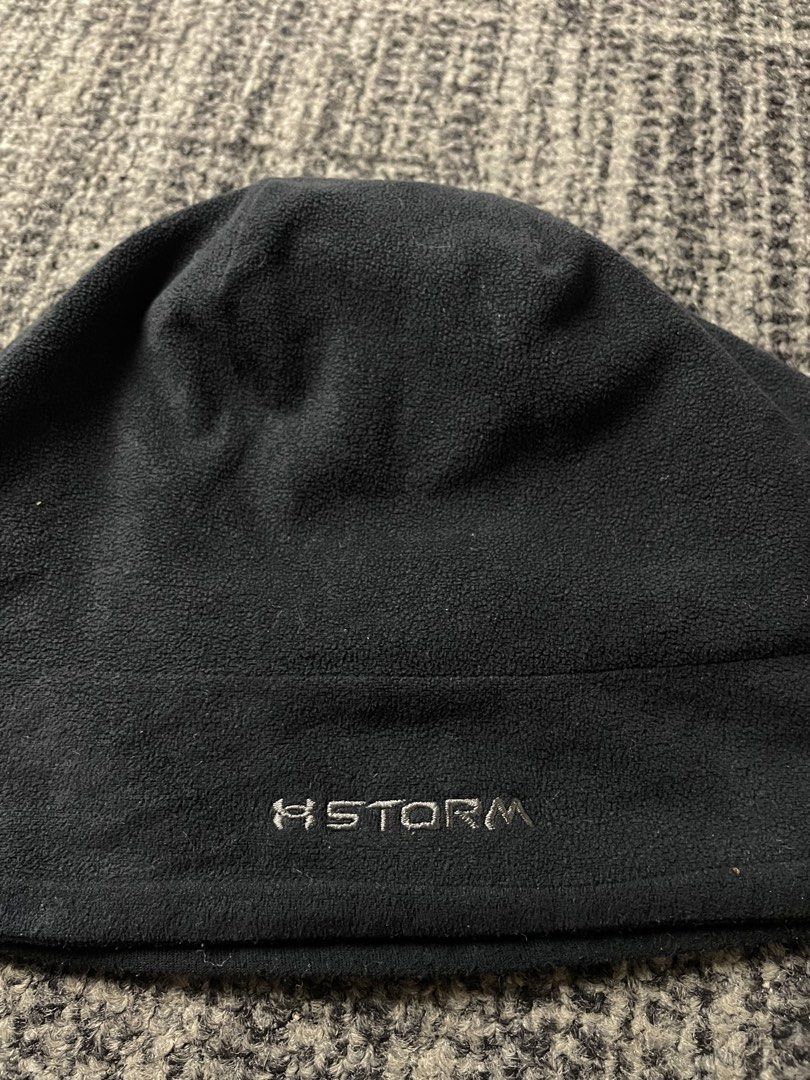 Under Armour Storm Fleece Beanie Black (Category: Caps & Hats) located in Manila. Submitted by rdtp2 (Listing ID 1470584746, Image 3). Description: - Brand: Under Armour - Color: Black - Material: Soft fleece fabric (blocks wind and holds warmth) - Details: Embroidered logo on front and Storm wordmark near hem - Size: Measures approx. 11 inches across (laid flat) - Condition: Great cold weather hat, inner tag has completely faded from use - Best 
