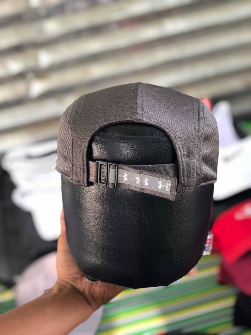 Under Armour Women's Run Cap Grey OSFA (Category: Activewear) located in Manila. Submitted by jowiegarci63146 (Listing ID 1470562261, Image 3). Description: - Brand: Under Armour - Color: Grey with pink side logo - Size: Women's OSFA (One Size Fits All) - Material/Design: Breathable mesh panels inside for ventilation - Strap: Adjustable back strap with Under Armour logo tape - Sweatband: Interior band with repeating 'Run' graphics - Condition: Ex