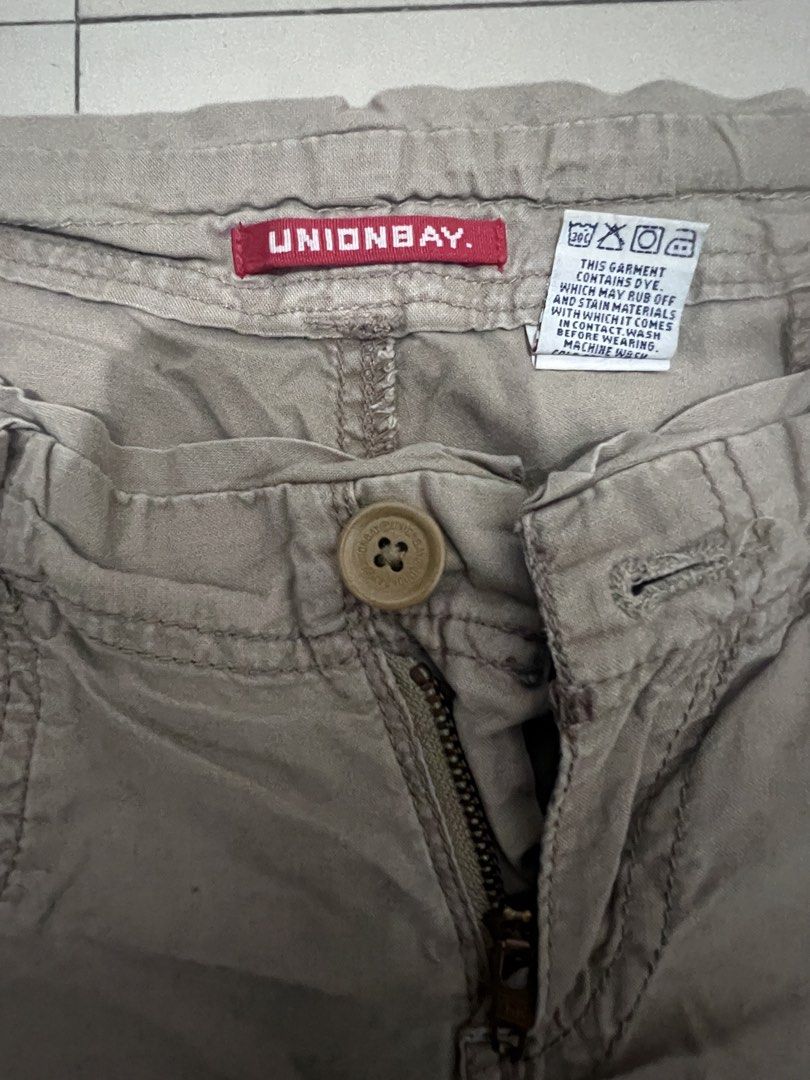 Unionbay beige cargo utility shorts (Category: Shorts) located in Caloocan City. Submitted by guaconerva97479 (Listing ID 1470731086, Image 3). Description: - Brand/Style: Unionbay utility shorts in a cool khaki beige wash - Fit: Low-rise style with a front button closure and zippered fly - Storage: Multiple functional cargo pockets and back patch pockets with button flaps - Details: Trendy drawstring accents on the front hips .