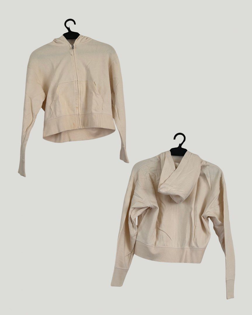 Uniqlo Beige Cropped Jacket (Category: Coats, Jackets and Outerwear) located in Paranaque City. Submitted by jackie.g (Listing ID 1470598210, Image 2). Description: - Brand: Uniqlo - Color: Versatile neutral beige - Style: Cropped jacket with attached hood and front zipper - Features: Practical front kangaroo pocket, ribbed hem and cuffs - Fit & Use: Great easy-layering piece for cooler weather that matches almost any outfit - Condition: Minor st